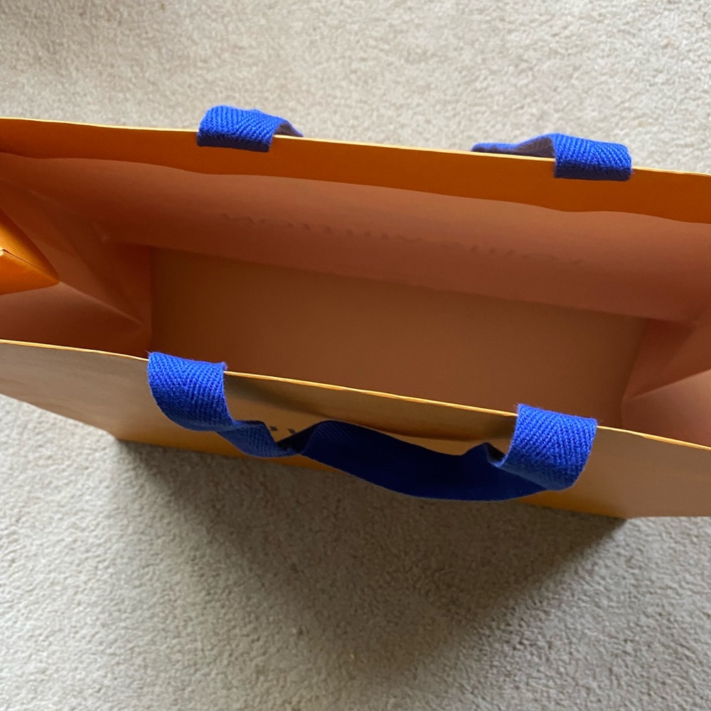 Louis Vuitton orange bag. Very nice  has blue handles